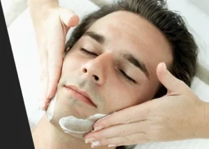 Men receiving a refreshing and rejuvenating facial clean-up treatment at Styles 'N' Smiles Unisex Salon, Singapore.